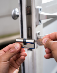 Locksmith working on a door lock in Atlanta